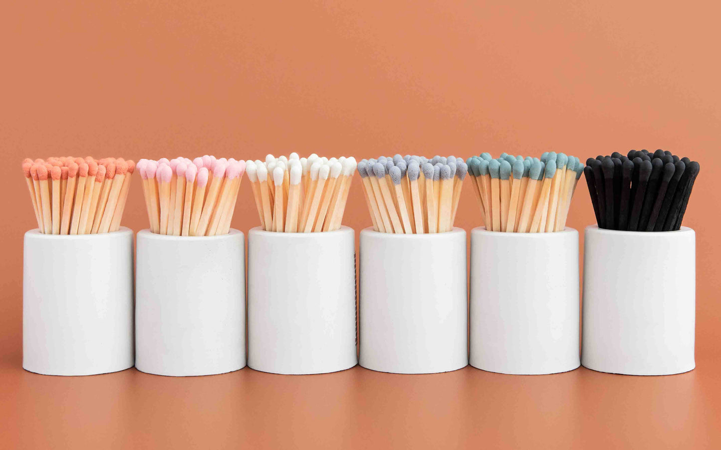 White Round Vessel with Baby Pink Matchsticks