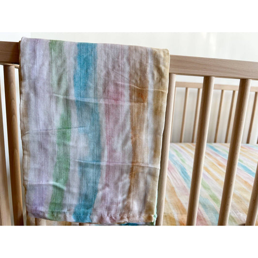 sunset stripes muslin swaddle